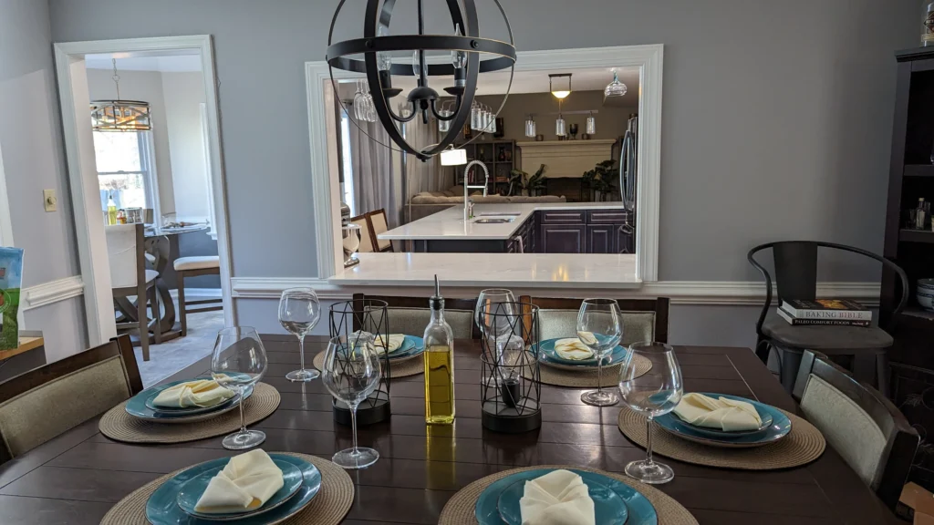 Dark kitchen with window to dining room