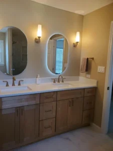 Dual vanity with warm lights and 2 mirrors